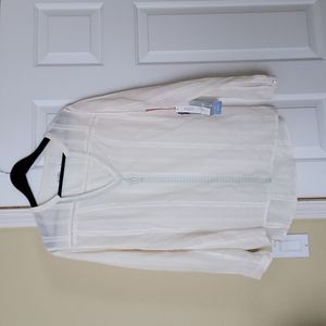 Ivory with green stitching long sleeved blouse.